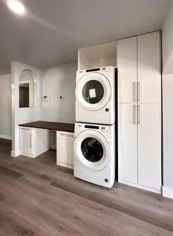 a view of a storage and utility room with washer and dryer