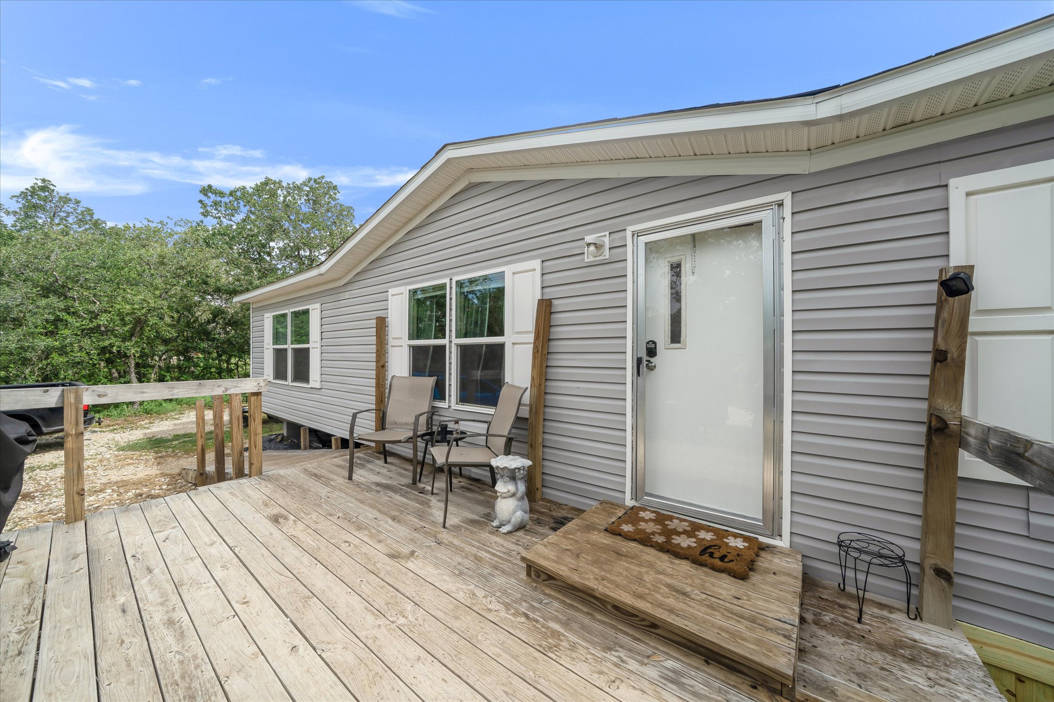 2755 Washburn Road Luling, TX 78648 - Photo 5 of 40 A spacious wooden deck provides an inviting entrance to this charming residence.
