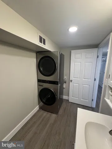 a view of a hallway with washer and dryer