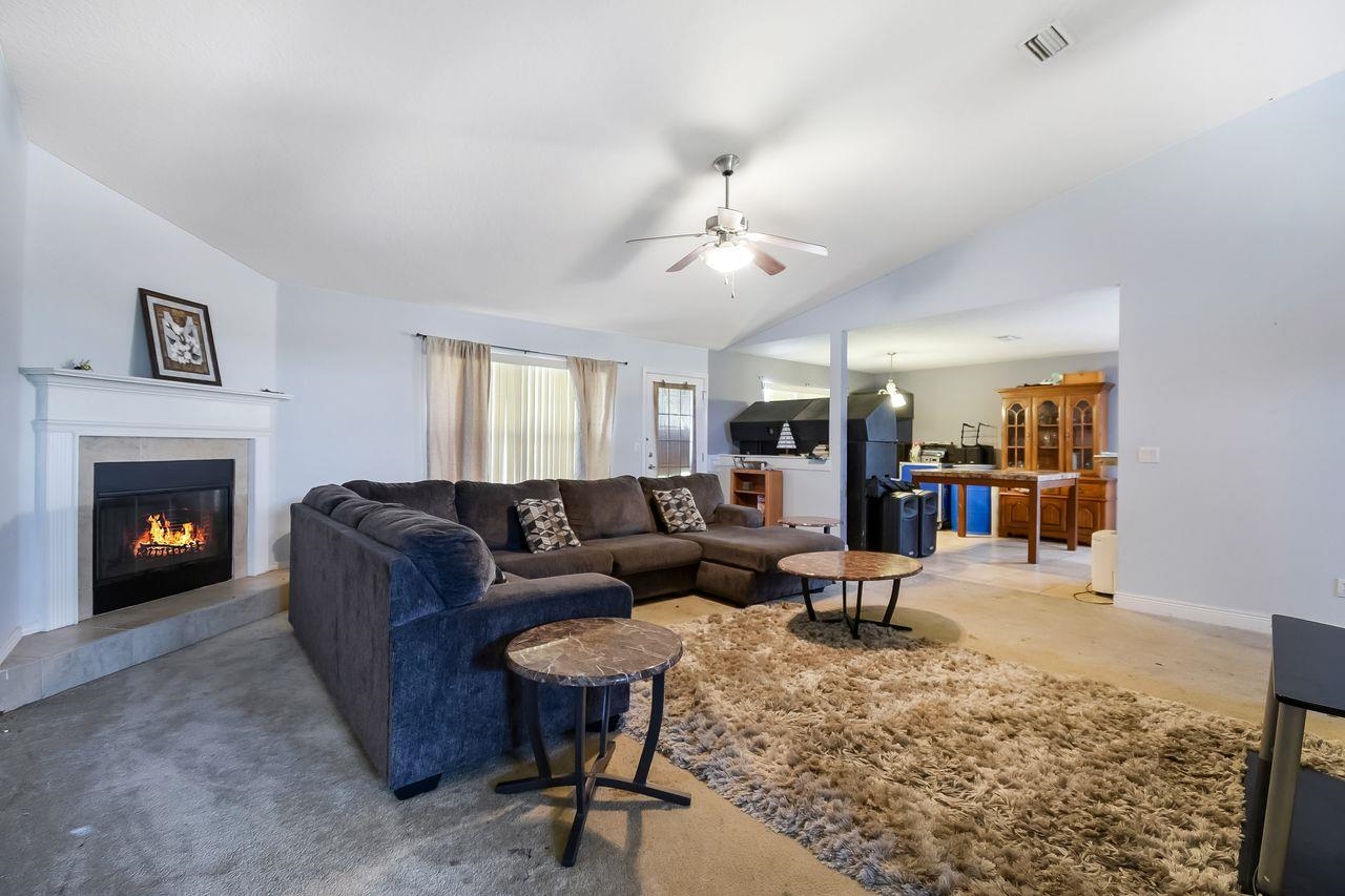 46 Riddle Drive Palm Coast, FL 32164 - Photo 4 of 20 a living room with furniture and a fireplace