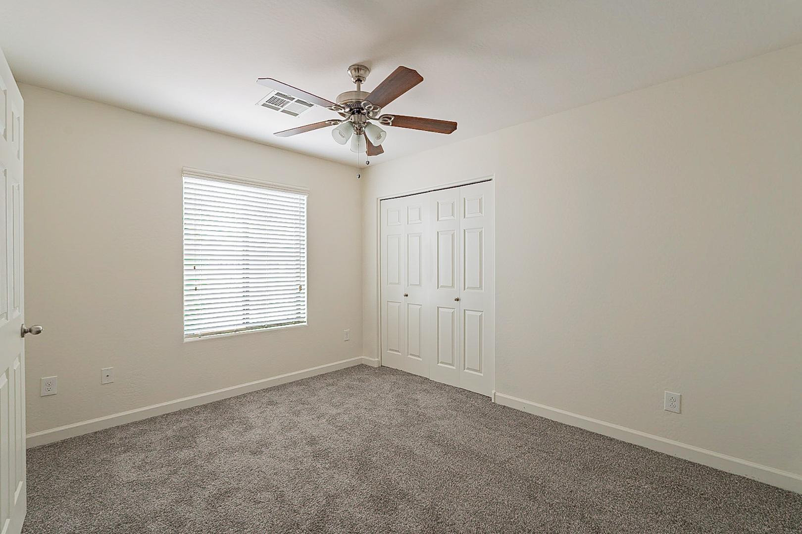 17223 North Cave Creek Road, Unit 7 Phoenix, AZ 85032 - Photo 12 of 23 a view of an empty room with a window