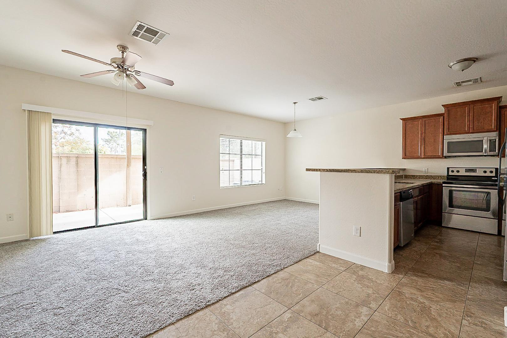 17223 North Cave Creek Road, Unit 7 Phoenix, AZ 85032 - Photo 2 of 23 a view of a kitchen with a stove cabinets and a kitchen