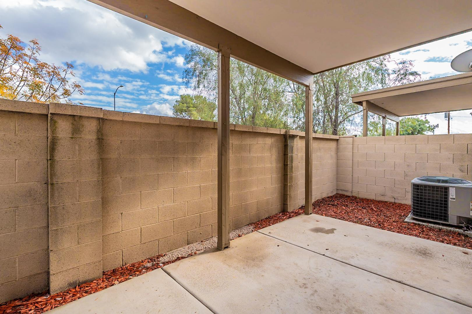 17223 North Cave Creek Road, Unit 7 Phoenix, AZ 85032 - Photo 22 of 23 a bedroom with a bed and a window