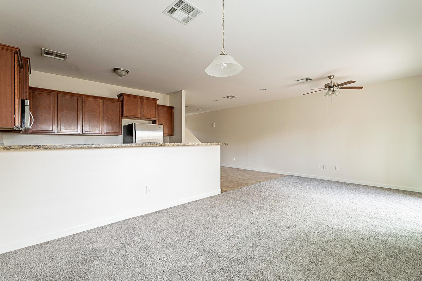17223 North Cave Creek Road, Unit 7 Phoenix, AZ 85032 - Photo 4 of 23 a view of a kitchen with a sink and cabinets