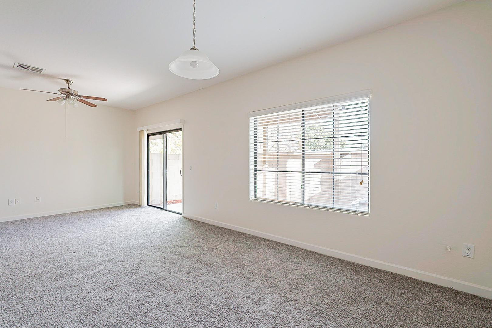 17223 North Cave Creek Road, Unit 7 Phoenix, AZ 85032 - Photo 5 of 23 a view of an empty room with a window