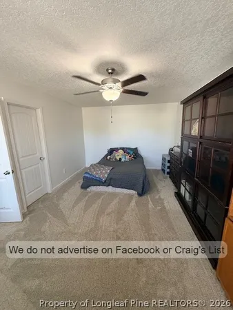 a black and white bed sitting in a bedroom