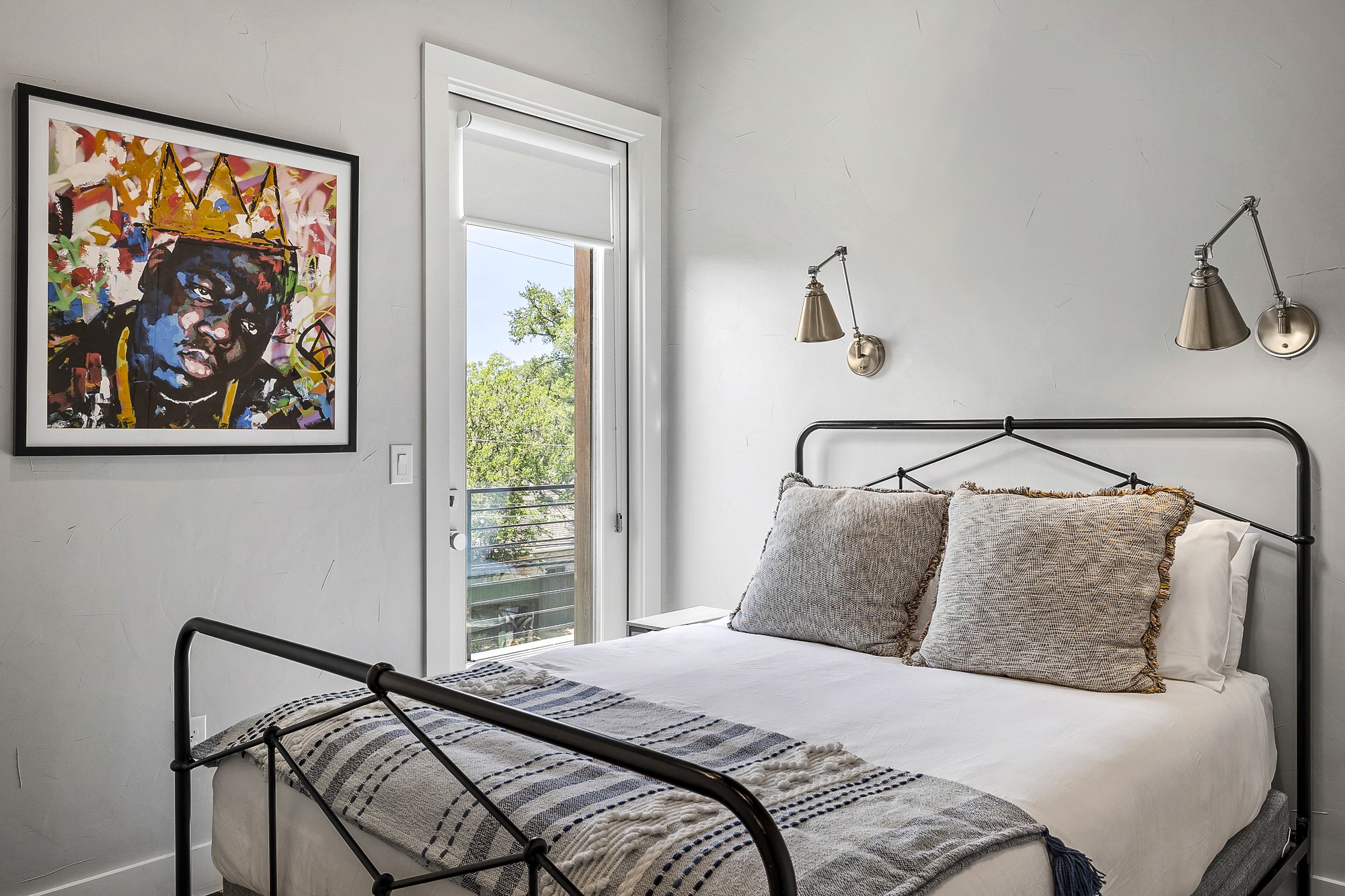 2414 Kinney Road Austin, TX 78704 - Photo 17 of 40 a bedroom with a bed and a painting on the wall