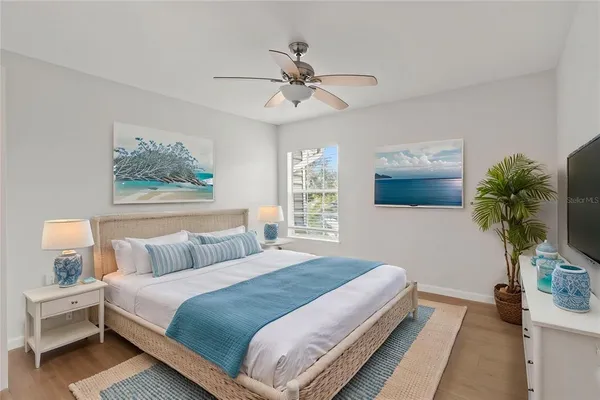 a bedroom with a large bed and a window