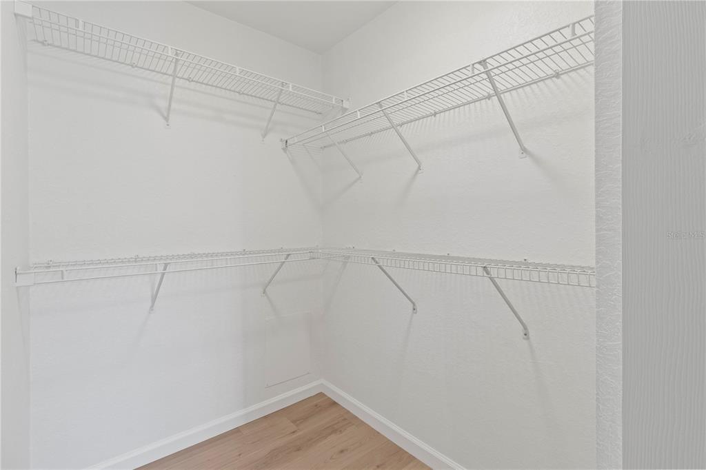 8827 Manor Loop, Unit 201 Lakewood Ranch, FL 34202 - Photo 19 of 39 a view of a room with racks on the wall