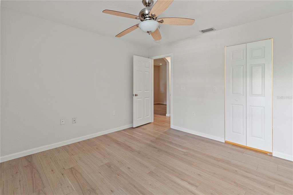 8827 Manor Loop, Unit 201 Lakewood Ranch, FL 34202 - Photo 19 of 41 wooden floor in an empty room
