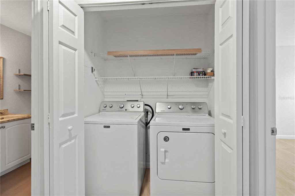 8827 Manor Loop, Unit 201 Lakewood Ranch, FL 34202 - Photo 21 of 41 a utility room with dryer and washer
