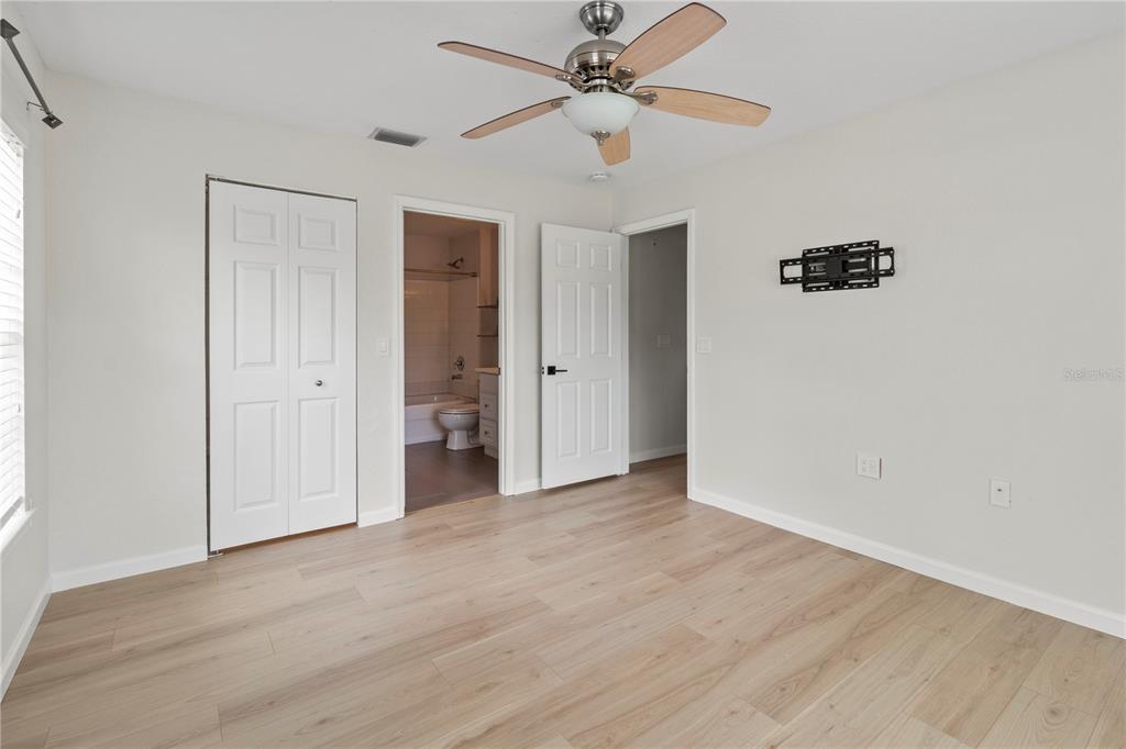 8827 Manor Loop, Unit 201 Lakewood Ranch, FL 34202 - Photo 22 of 39 wooden floor in an empty room