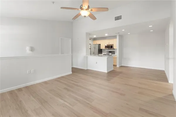 a view of a kitchen with a sink and a window