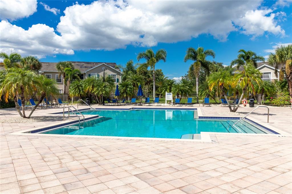 8827 Manor Loop, Unit 201 Lakewood Ranch, FL 34202 - Photo 38 of 41 a view of a yard and palm trees