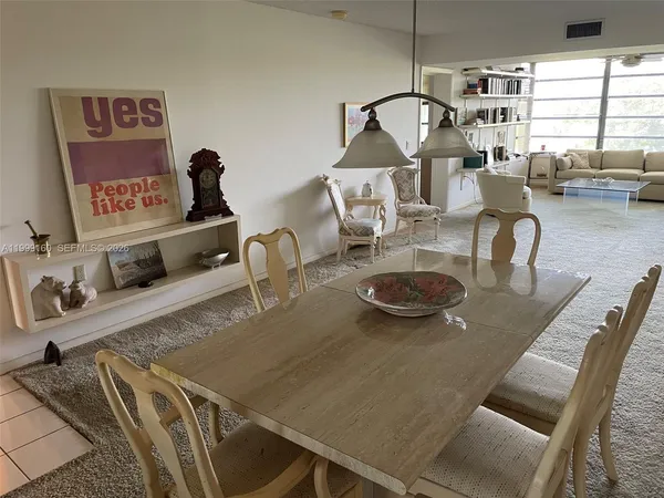 a view of a dining room with furniture