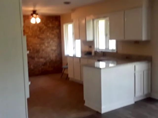 a view of cabinets and window