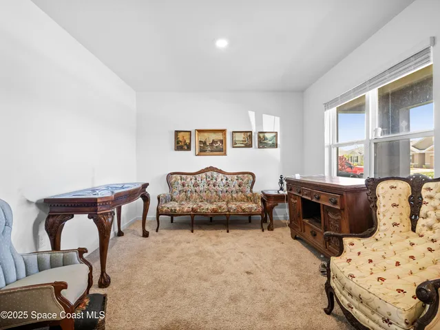 a bedroom with furniture and a window