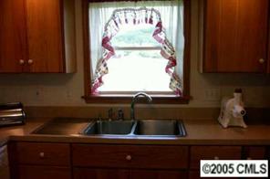 120 Lackey Mountain Road Hiddenite, NC 28636 - Photo 4 of 8 a kitchen with a sink and a window