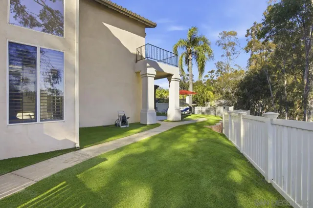 a view of a backyard with a patio
