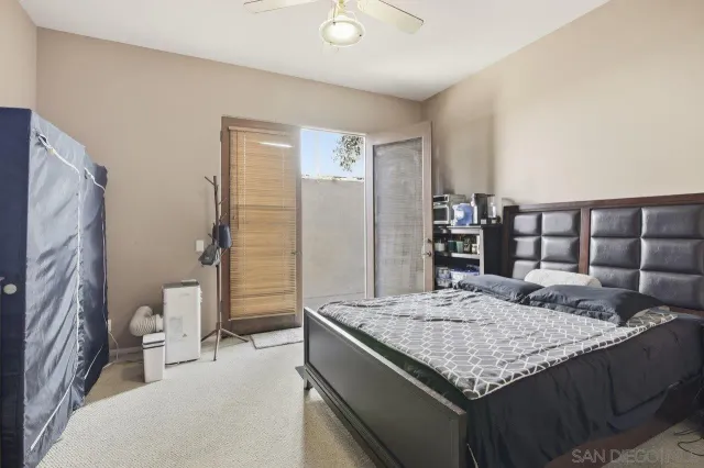 a bed room with a bed and a television