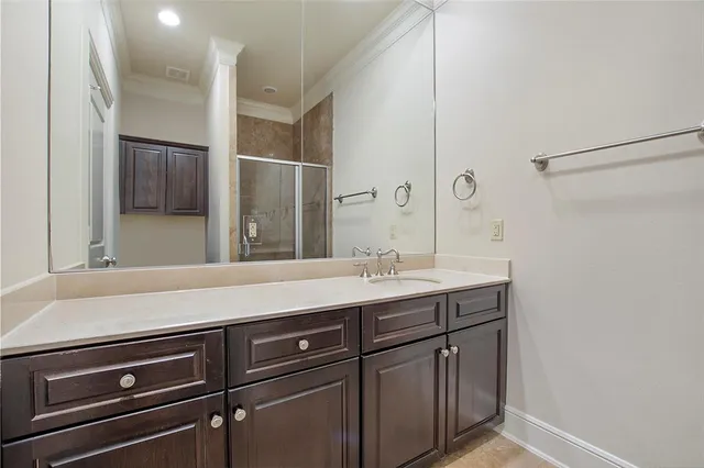 a sink with a shower and vanity