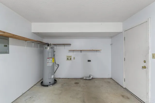 a view of storage and utility room with closet