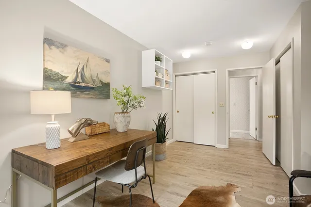 a view of a dining room with furniture and wooden floor