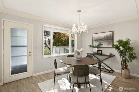 a view of a dining room with furniture and window