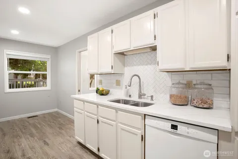 a kitchen with sink and window