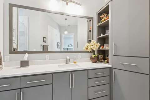 a bathroom with a sink and a mirror