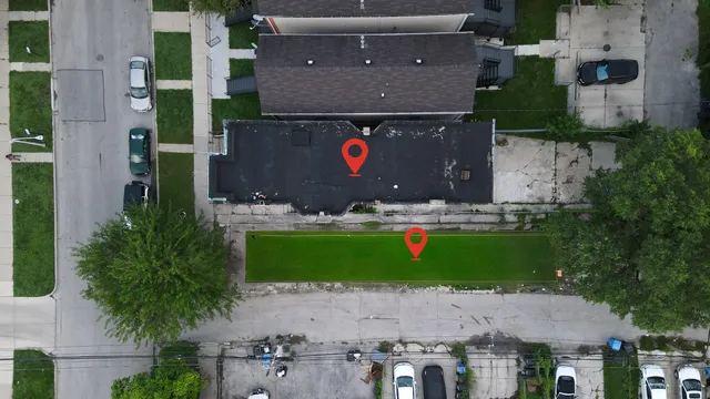 an aerial view of house with yard