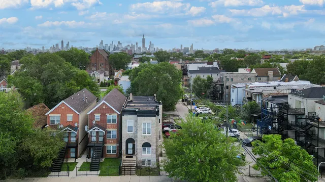 a aerial view of a house with a garden and trees