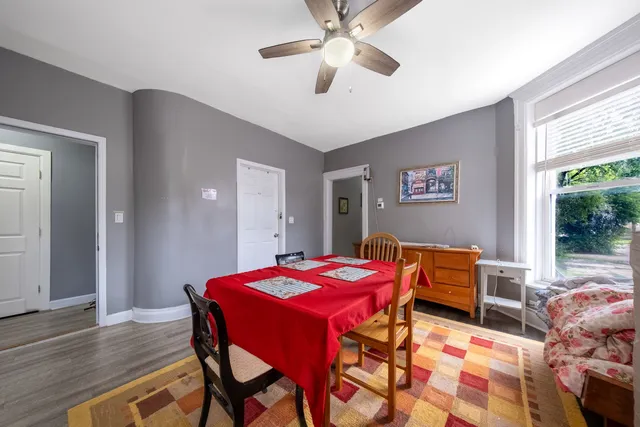 a dining room with furniture and window