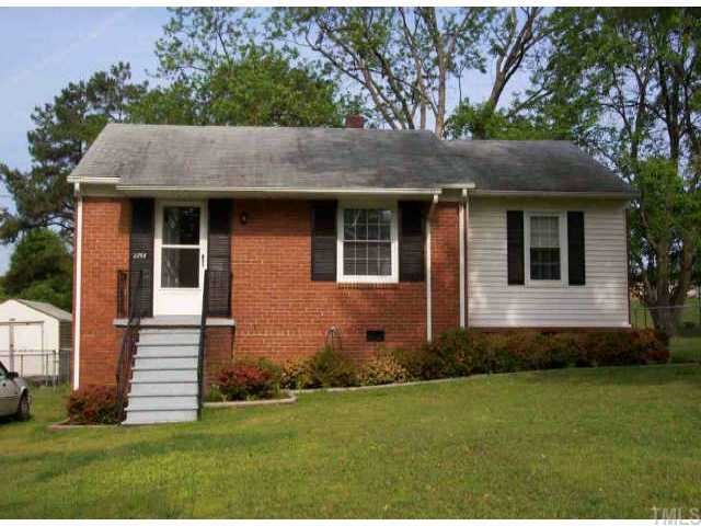 2752 Knowles Street Raleigh, NC 27603 - Photo 1 of 1 a front view of a house with a garden