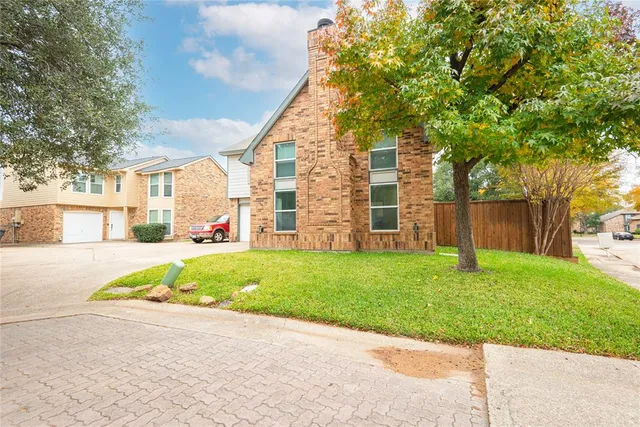 a view of a backyard with a garden and plants
