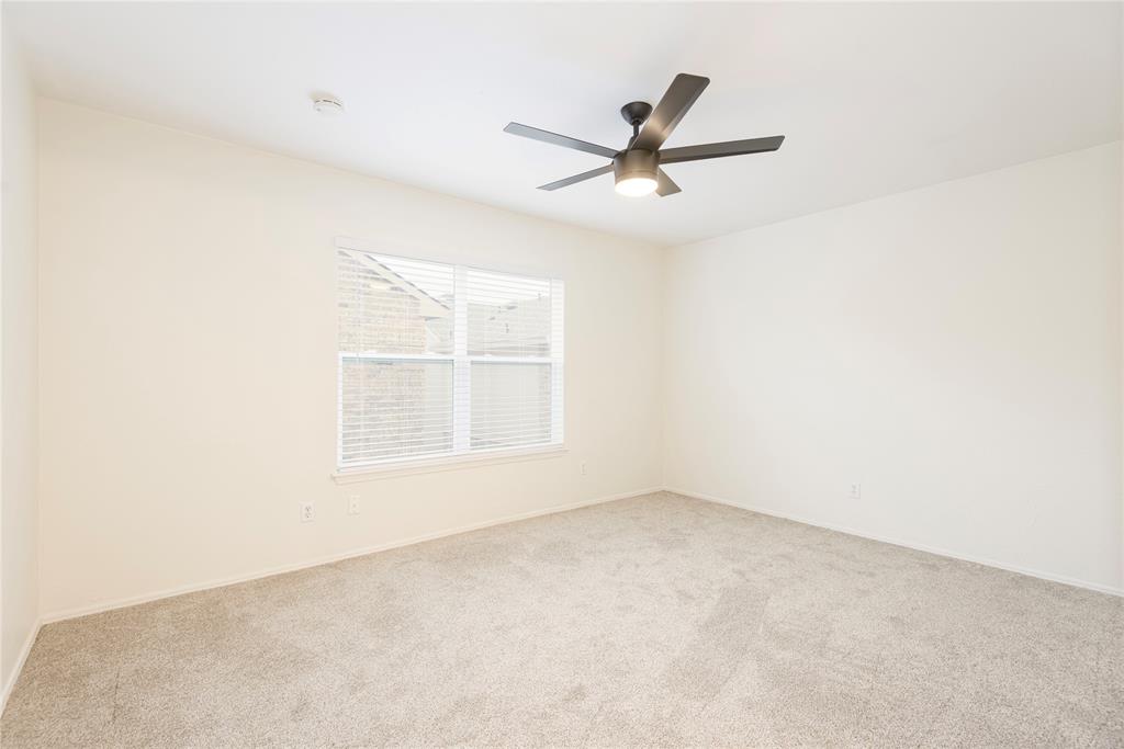 4080 Windhaven Lane Dallas, TX 75287 - Photo 17 of 24 an empty room with a window and a fan