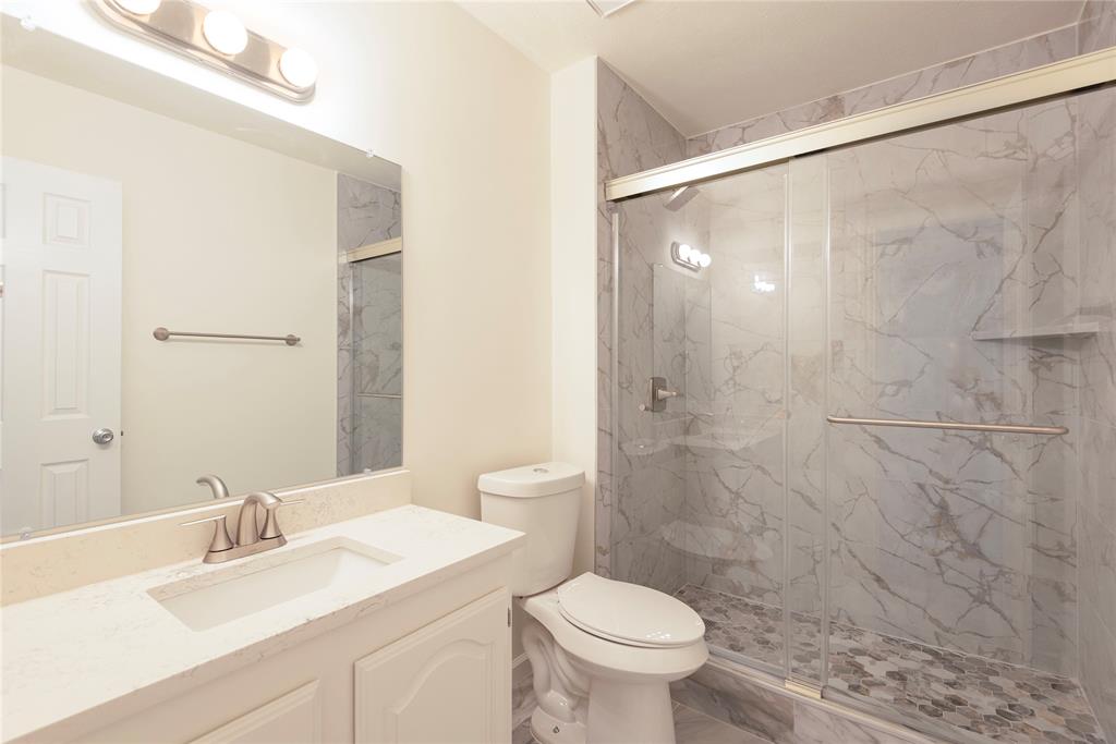 4080 Windhaven Lane Dallas, TX 75287 - Photo 22 of 24 a bathroom with a sink and a mirror