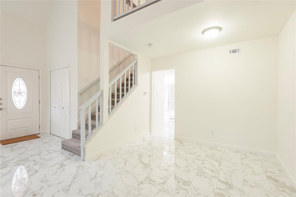 4080 Windhaven Lane Dallas, TX 75287 - Photo 5 of 24 a view of an entryway with staircase