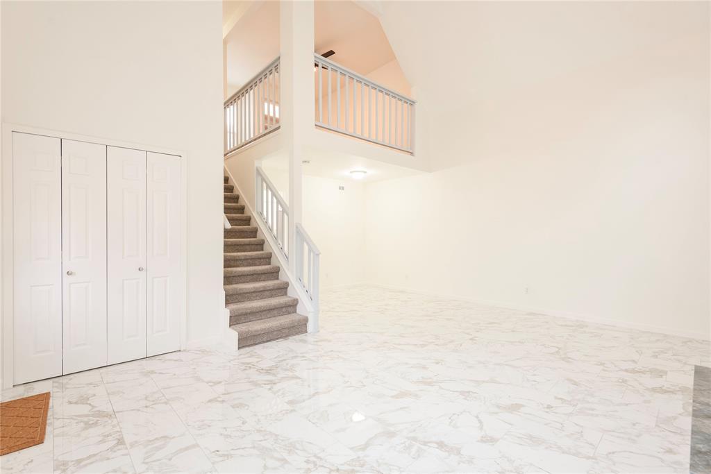 4080 Windhaven Lane Dallas, TX 75287 - Photo 9 of 24 a view of a hallway with staircase