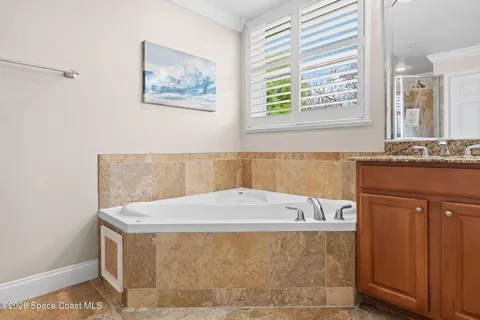a bathroom with a shower and a sink