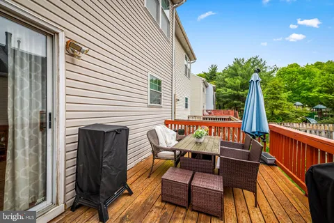 a balcony with table and chairs