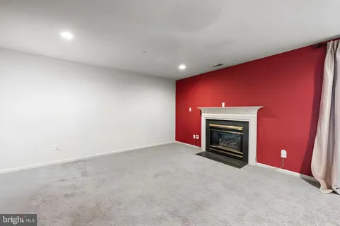 an empty room with a fireplace