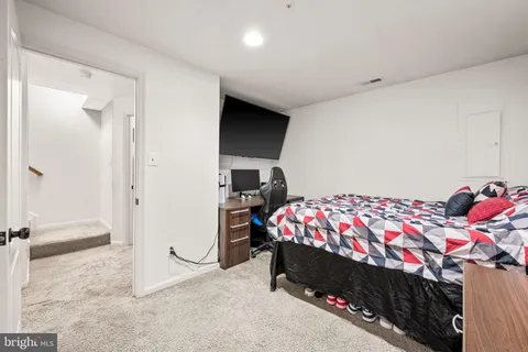 a bedroom with a bed and a cabinets