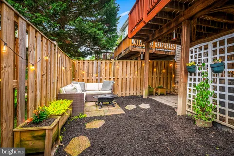 a backyard of a house with outdoor seating