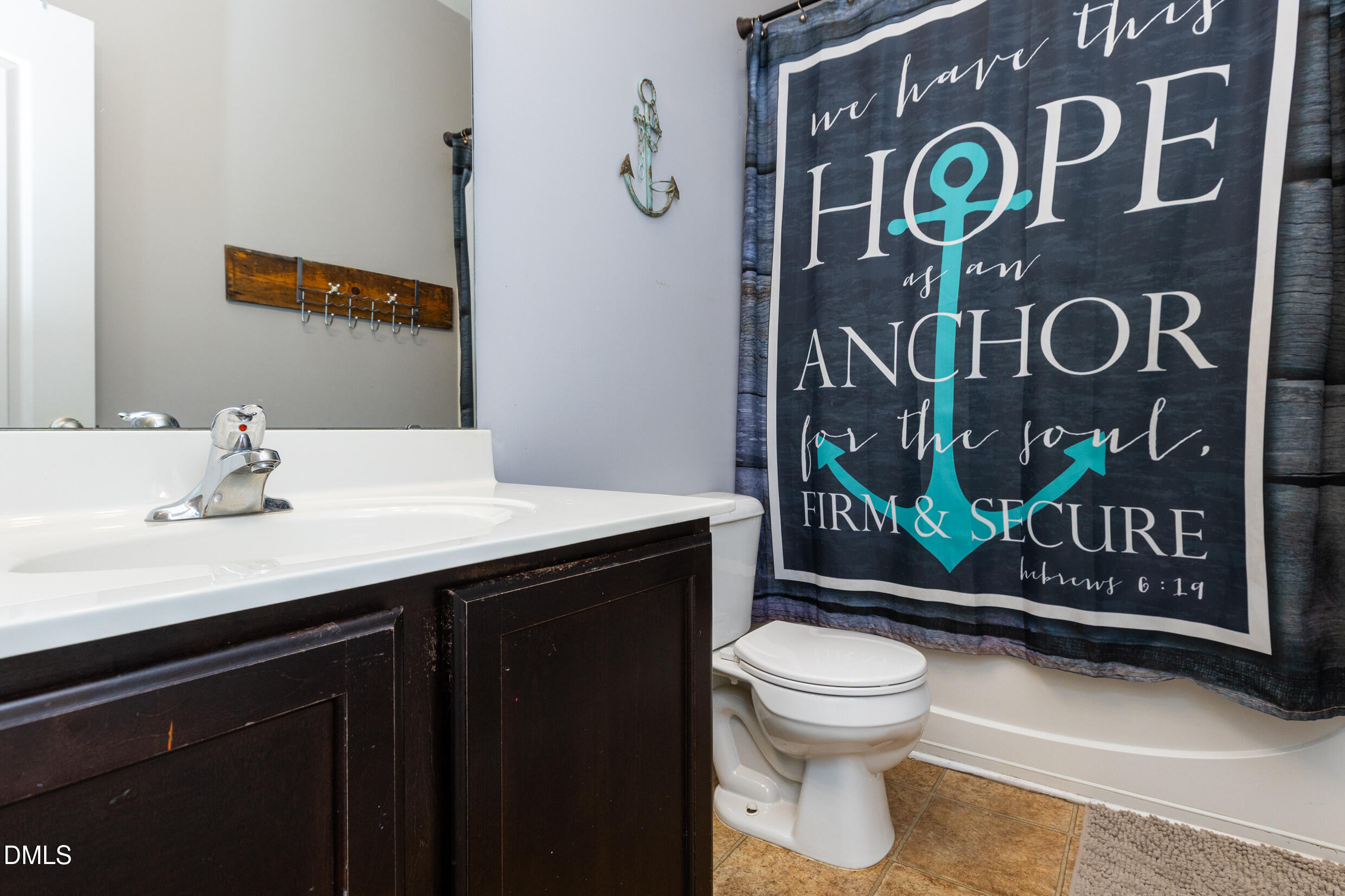 7250 Terregles Drive Raleigh, NC 27617 - Photo 10 of 19 a bathroom with a toilet sink and mirror
