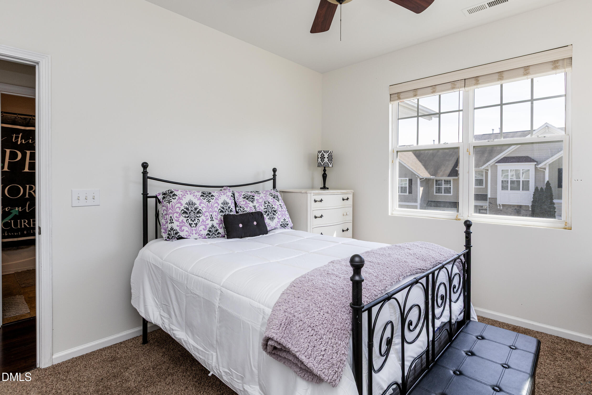 7250 Terregles Drive Raleigh, NC 27617 - Photo 15 of 19 a bedroom with a bed and a window