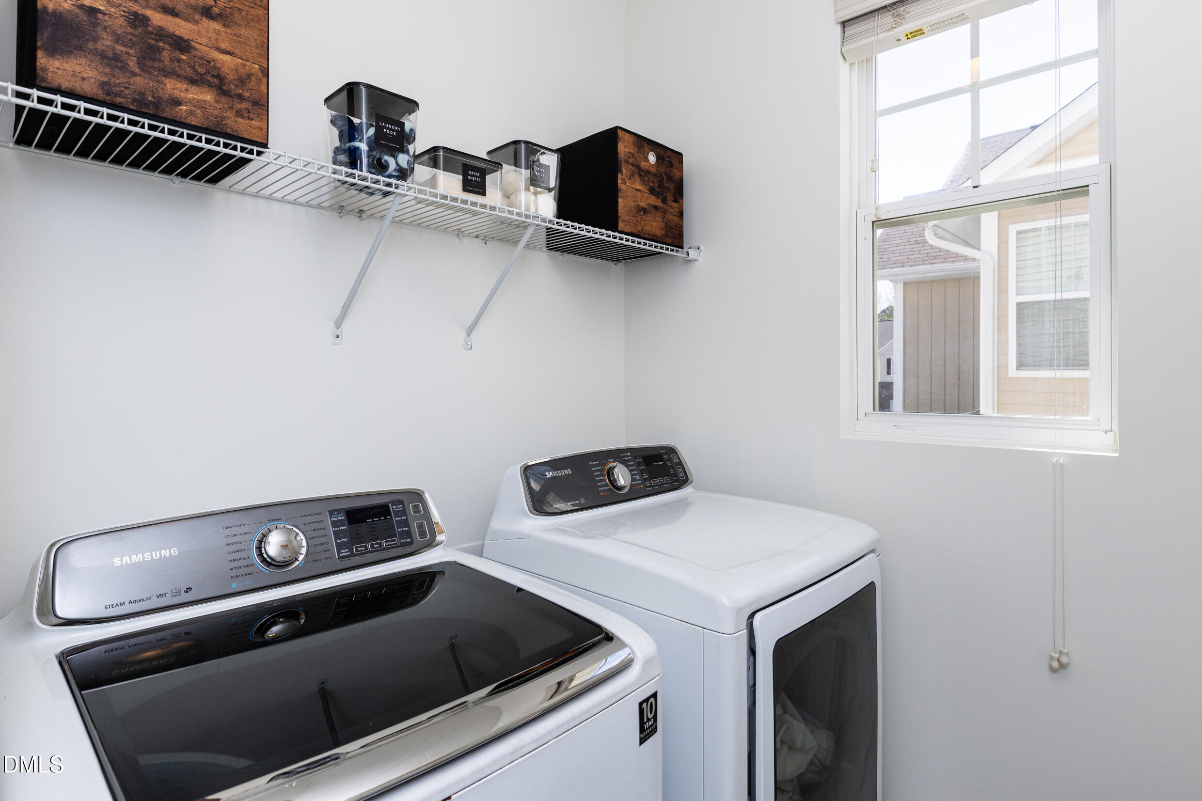 7250 Terregles Drive Raleigh, NC 27617 - Photo 17 of 19 a utility room with dryer and washer