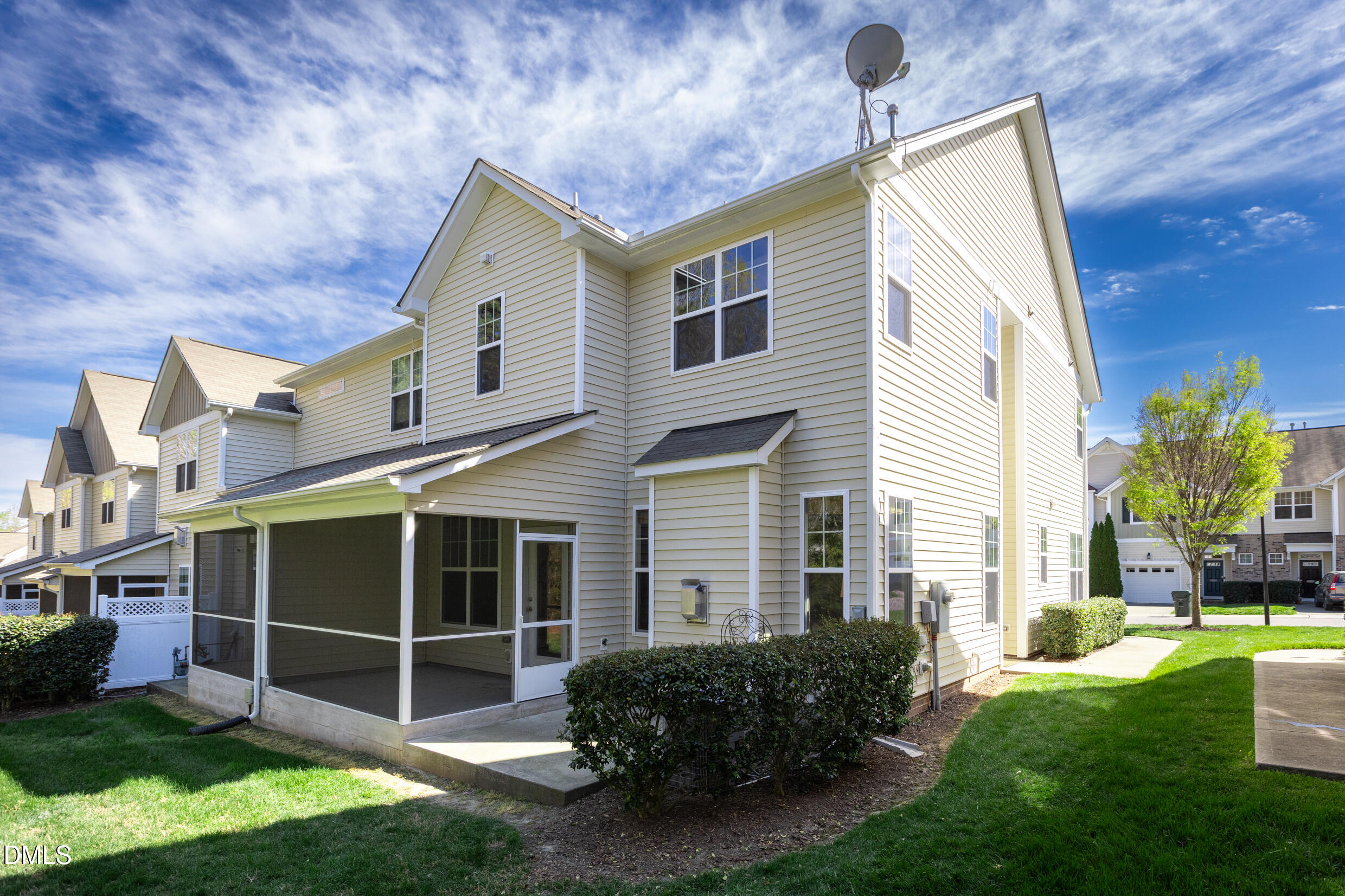 7250 Terregles Drive Raleigh, NC 27617 - Photo 18 of 19 a front view of a house with a yard and potted plants