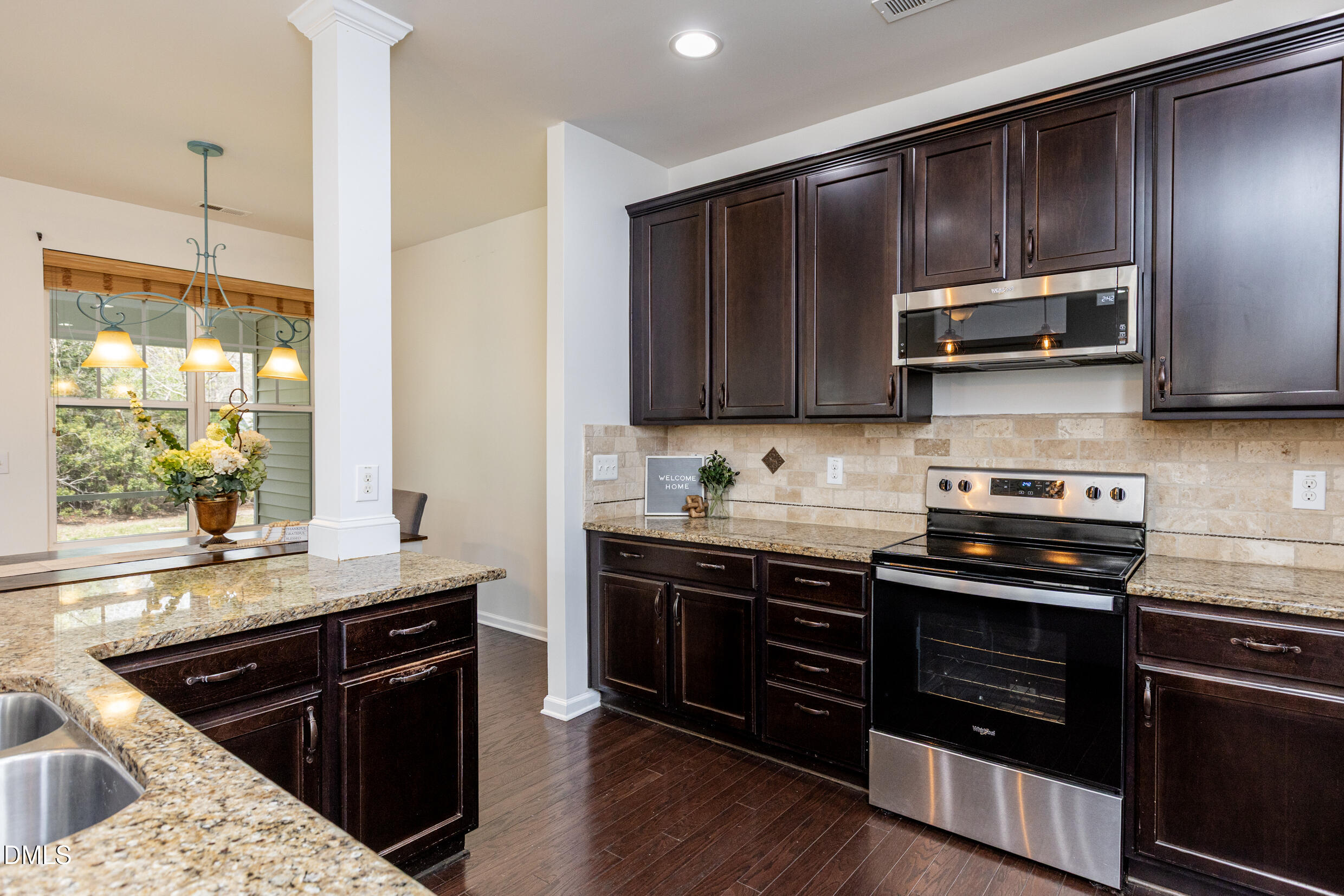 7250 Terregles Drive Raleigh, NC 27617 - Photo 5 of 19 a kitchen with a sink stove and microwave