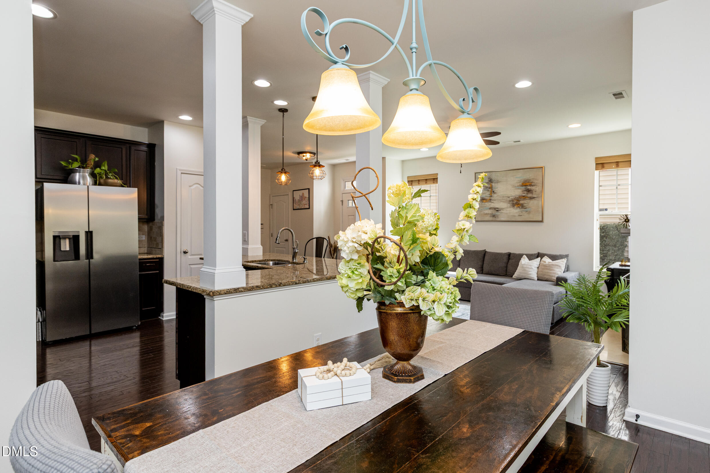 7250 Terregles Drive Raleigh, NC 27617 - Photo 7 of 19 a dining room with furniture and chandelier